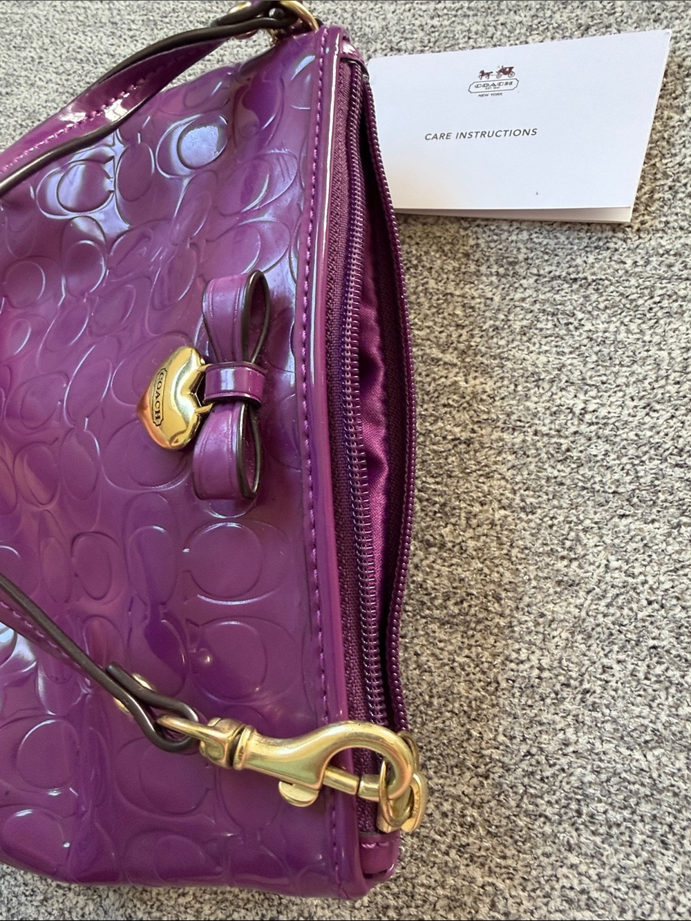 Coach Patent Signature Wristlet in Plum with Gold Heart Charm - Picture 4 of 5